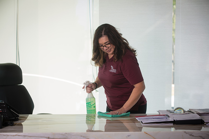 Wiping-down-office-table